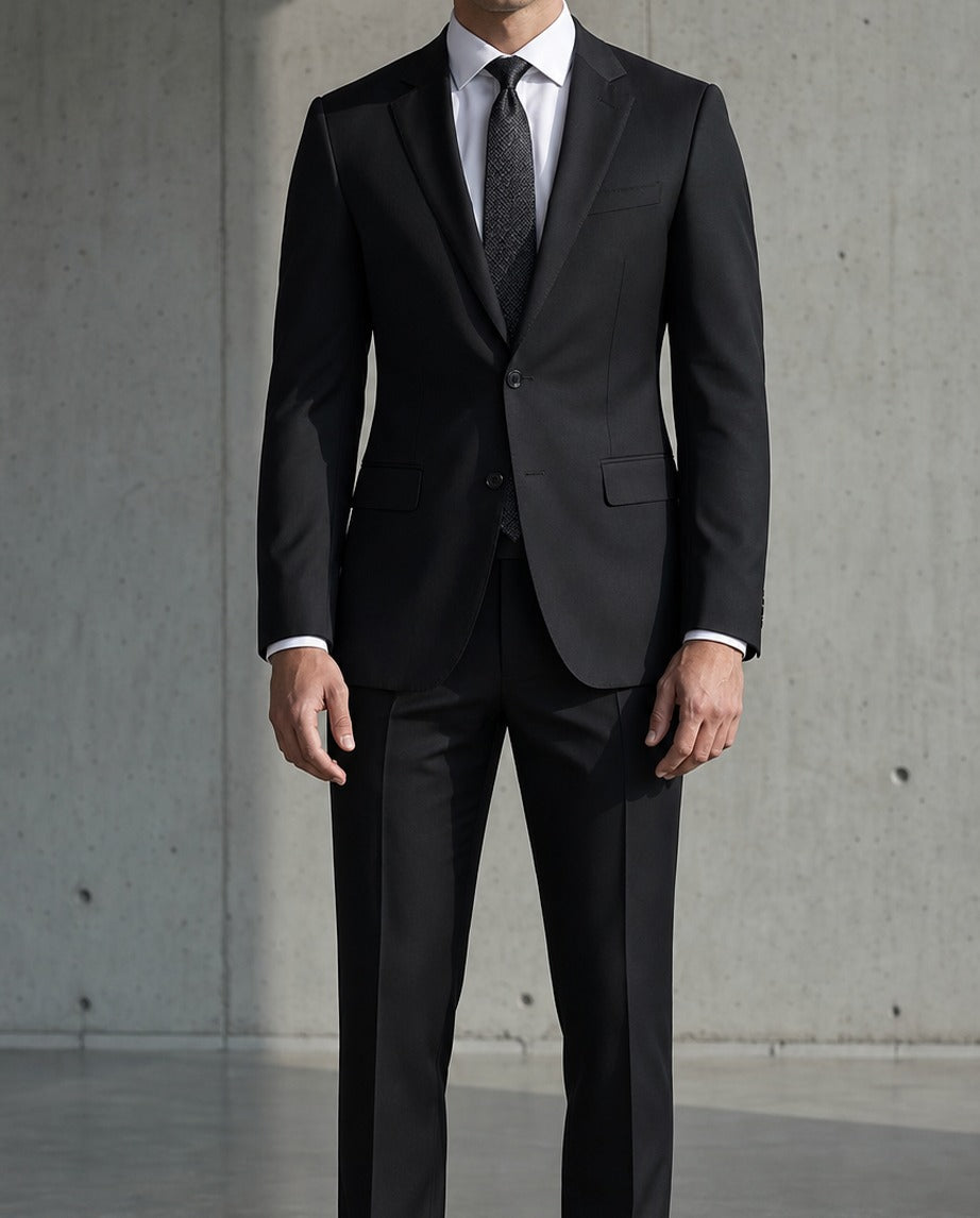 Le Domaine Suit - Affaires - black slim-fit two-piece suit worn by a model, full-length front view | Roi de Soi